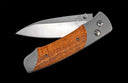 A-Series A200-13 Titanium pocketknife with stainless blade and curly koa wood
